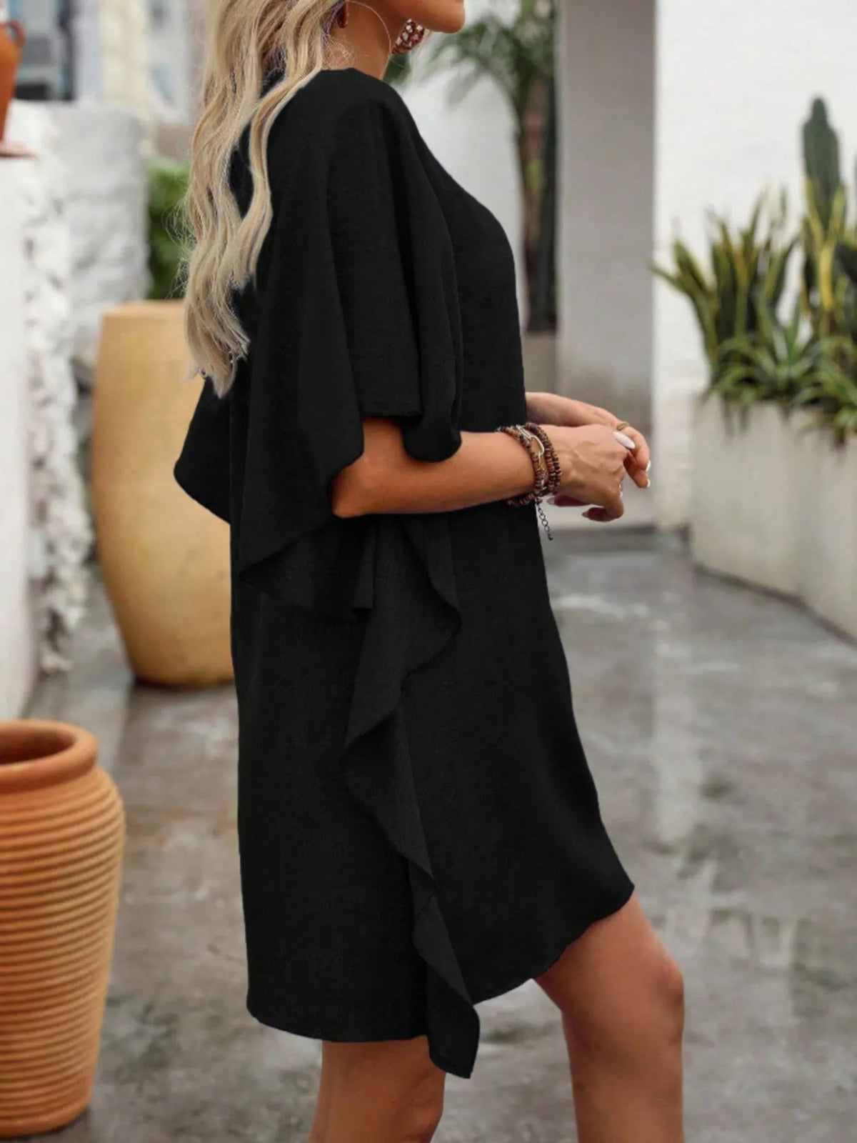 Women’s flowy V-neck casual mini dress with ruffled sleeves, stylish and comfortable from Plush Fashion Hub.