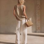 Women's sleeveless front-button cardigan, top, and long pants casualwear set by FitiqueFit, styled for relaxed, comfortable fashion.