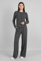 Women's ribbed knit cardigan and button-front trousers set by FitiqueFit, featuring a half-high-neck design and casual style.