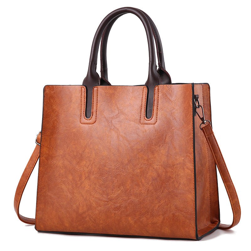Elegant women's handbag from LadyShow.Store featuring a sleek design, top handles, and stylish details for everyday use.