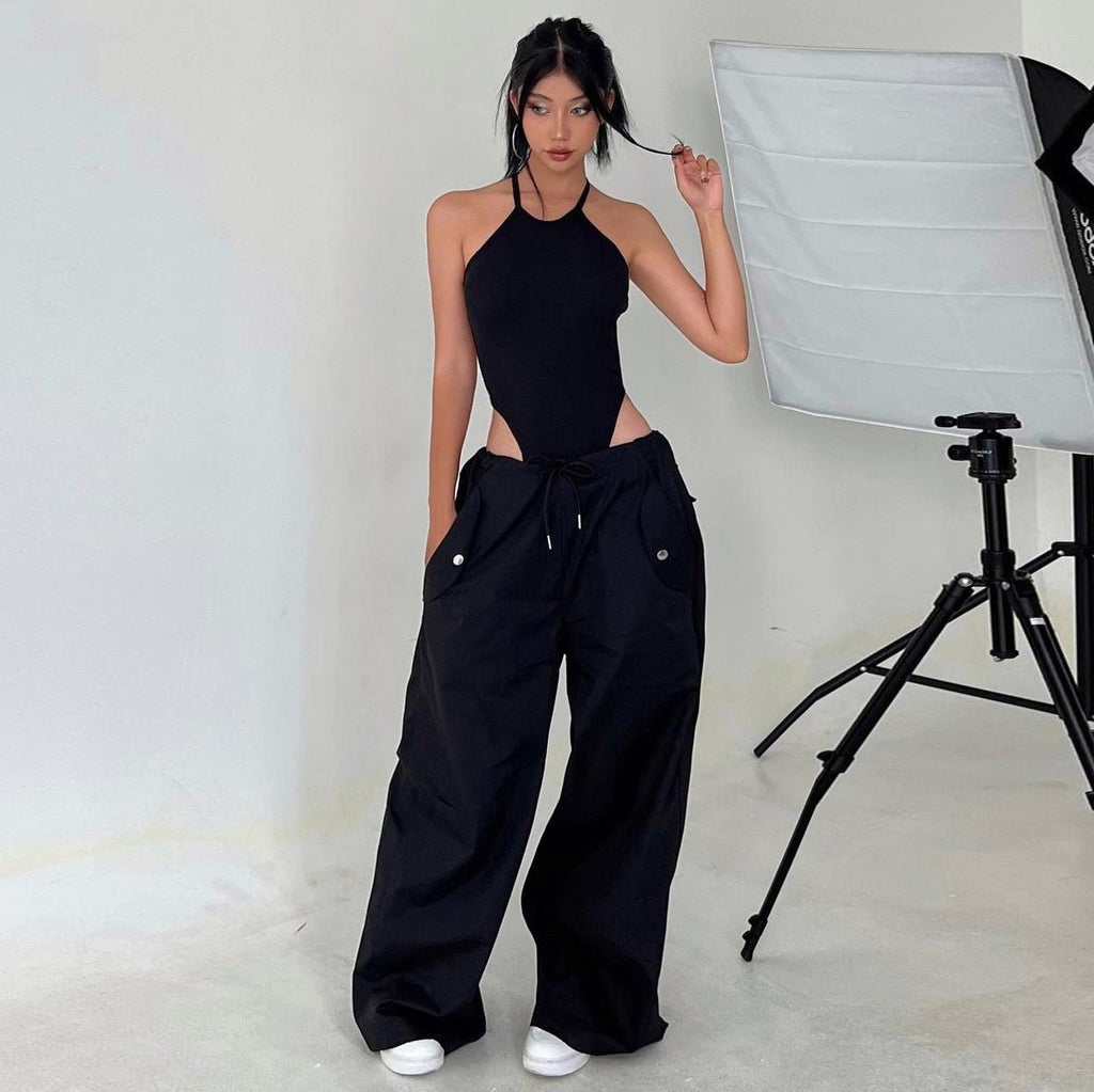 Women's high-waist lace-up straight-leg cargo pants in loose fit, casualwear by FitiqueFit, shown in a relaxed, stylish pose.