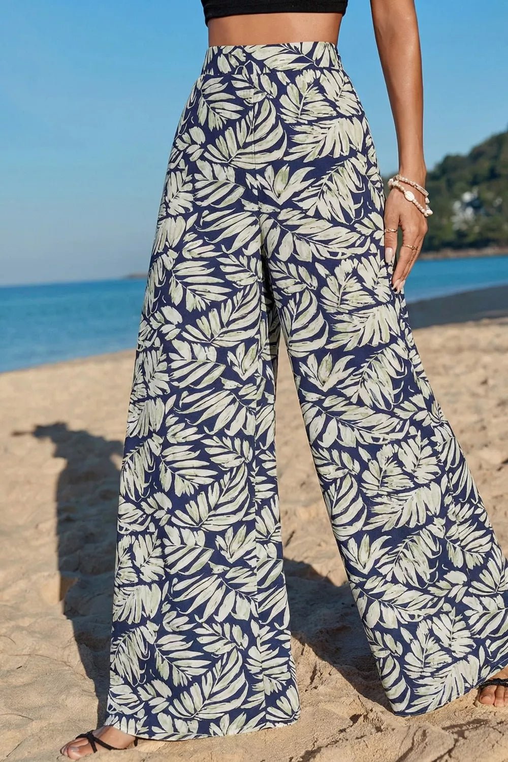 Women's high-waist leaf print wide-leg pants made of soft cotton blend, casual and comfortable for everyday wear.