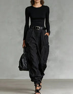 Women’s high-waist loose-fit wide-leg casual trousers by FitiqueFit, shown in a relaxed fit with flowing fabric and front pockets.