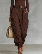 Women’s high-waist loose-fit wide-leg casual trousers by FitiqueFit, shown hanging with relaxed fit and soft fabric.