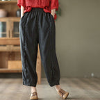 Women's high-waist solid-color harem capri pants in casualwear style, featuring a relaxed fit and comfortable waistband.