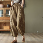 Women's high-waist solid-color harem capri pants from FitiqueFit, featuring a relaxed fit and comfortable casualwear style.