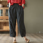 Women's high-waist solid-color Capri harem pants in casualwear style, made by FitiqueFit, shown on a model.