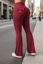 Black women's high-waisted cargo pocket workout leggings by FitiqueFit, featuring a snug fit and functional side pockets for casualwear.