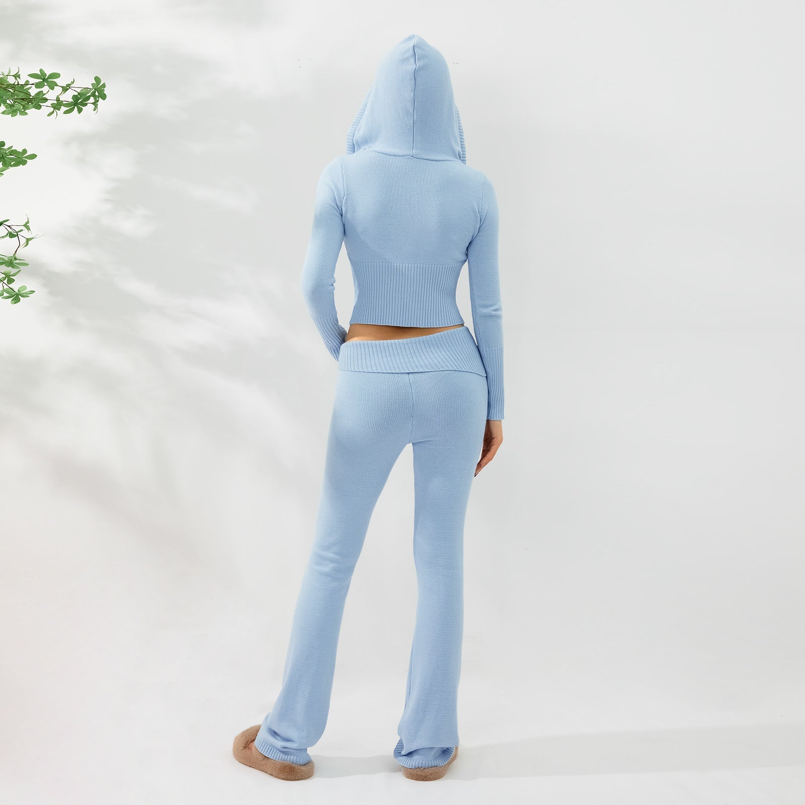 Women’s knitted hooded two-piece set with cardigan and high-waisted pants, stylish and cozy fitiqueFit women's sweater suit.