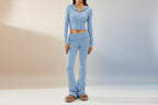 Women’s knitted hooded two-piece set with cardigan and high-waisted pants from FitiqueFit, featuring cozy knit fabric and casual style.