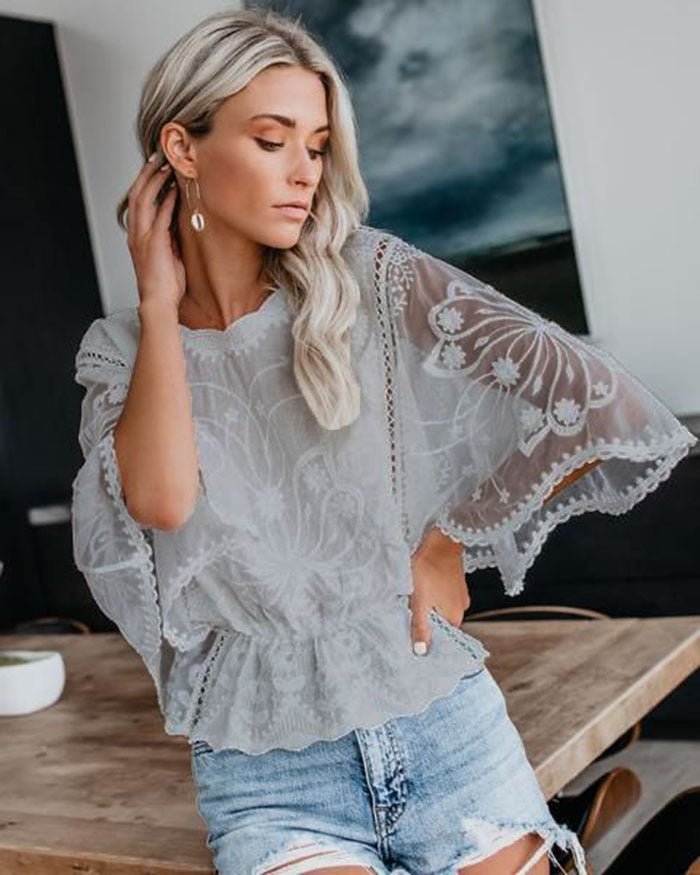 Women’s lace trim short sleeve batwing casual top by FitiqueFit, featuring delicate lace details and a relaxed fit.
