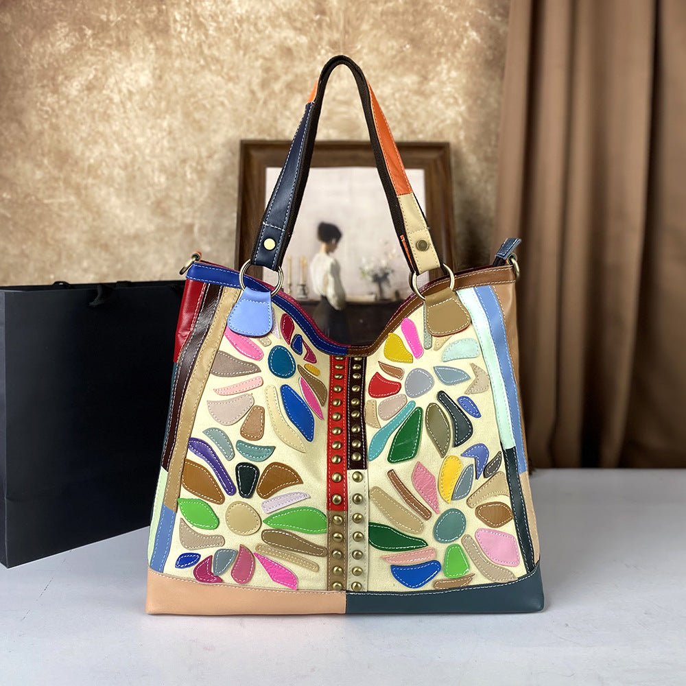 Large-capacity women's leather crossbody bag with nautical-style design, featuring adjustable strap and spacious interior.