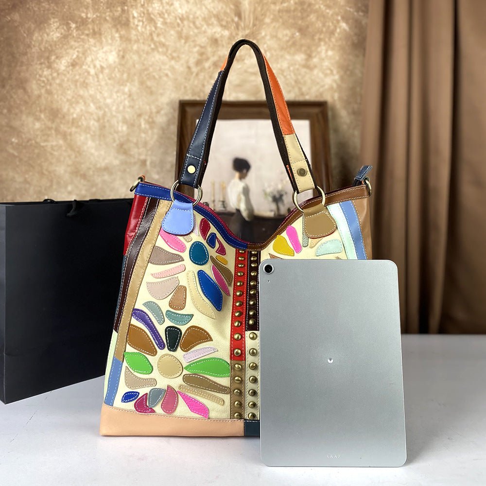 Large genuine leather women's crossbody bag with nautical-style design, featuring spacious compartments and stylish marine-inspired details.