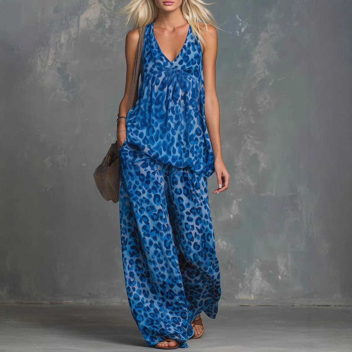 Women’s leopard print sleeveless top and chiffon pants set by FitiqueFit, casualwear outfit with stylish animal print and flowing fabric.