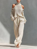 Women's long-sleeve turtleneck top and pants set by FitiqueFit, stylish casualwear with an elegant 2-piece design.