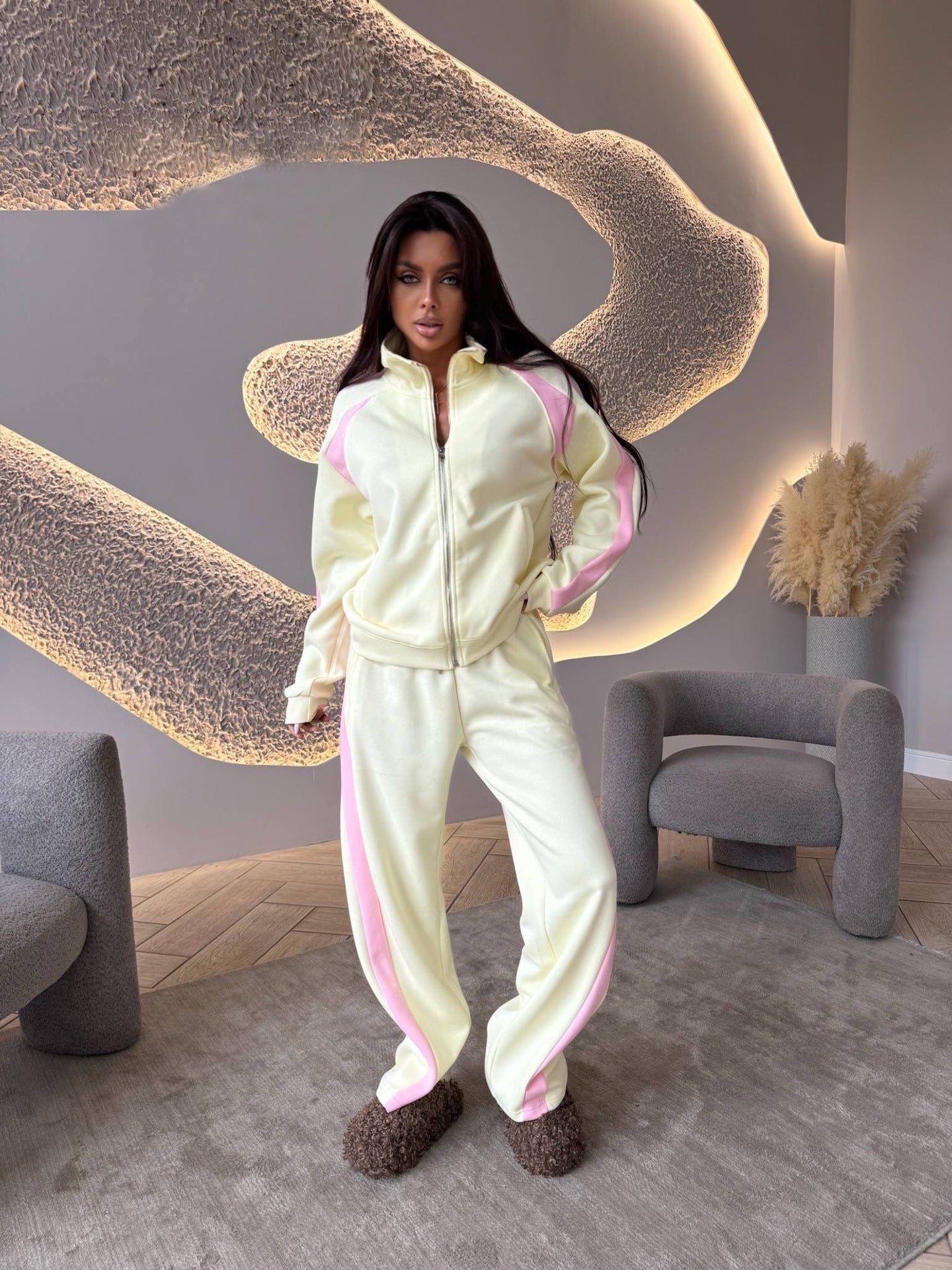 Women’s long-sleeve zip-up jacket and sweatpants two-piece set by FitiqueFit, casual athletic wear, blue color, front view.