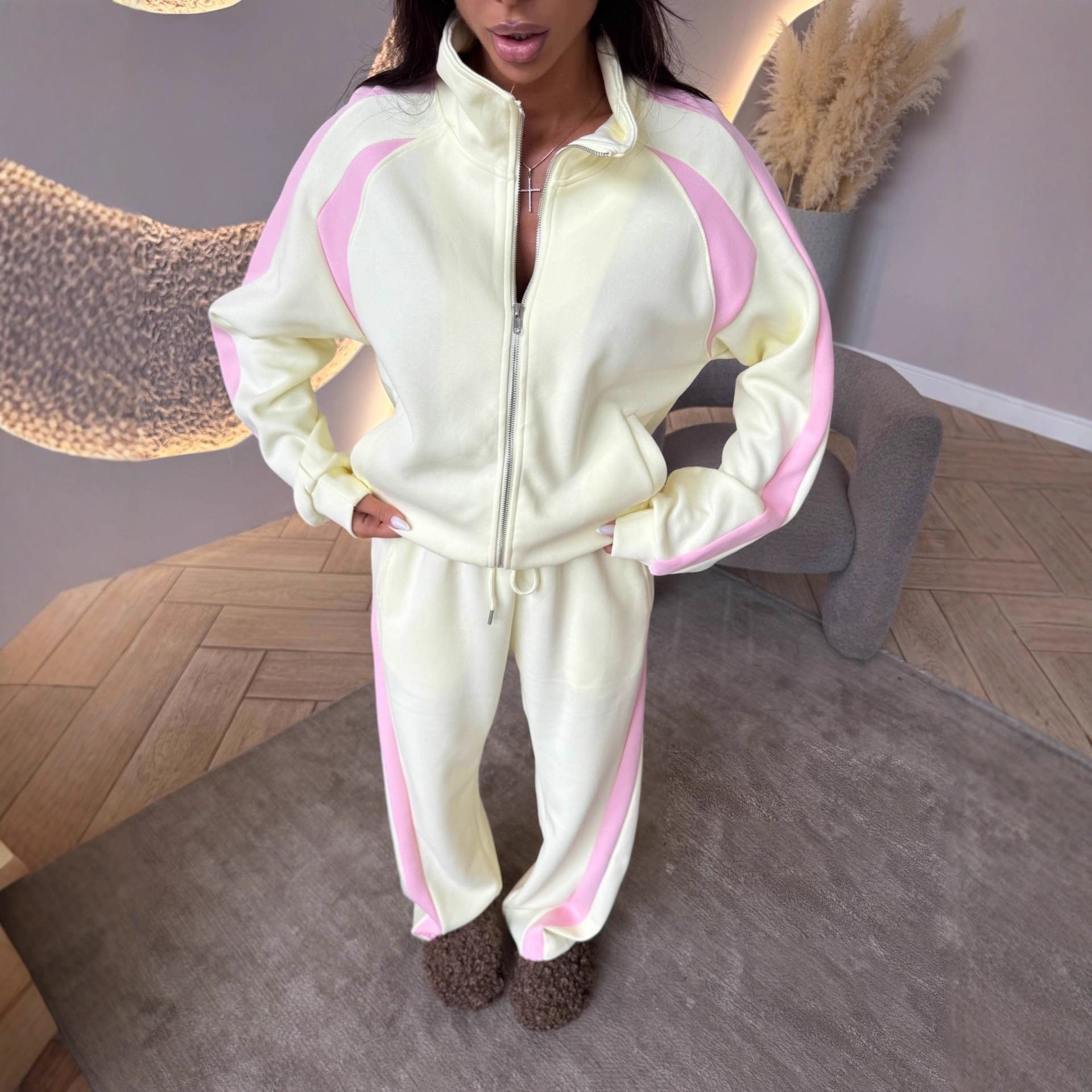 Women’s long-sleeve zip-up jacket and sweatpants two-piece set by FitiqueFit, featuring comfortable casual athletic wear.