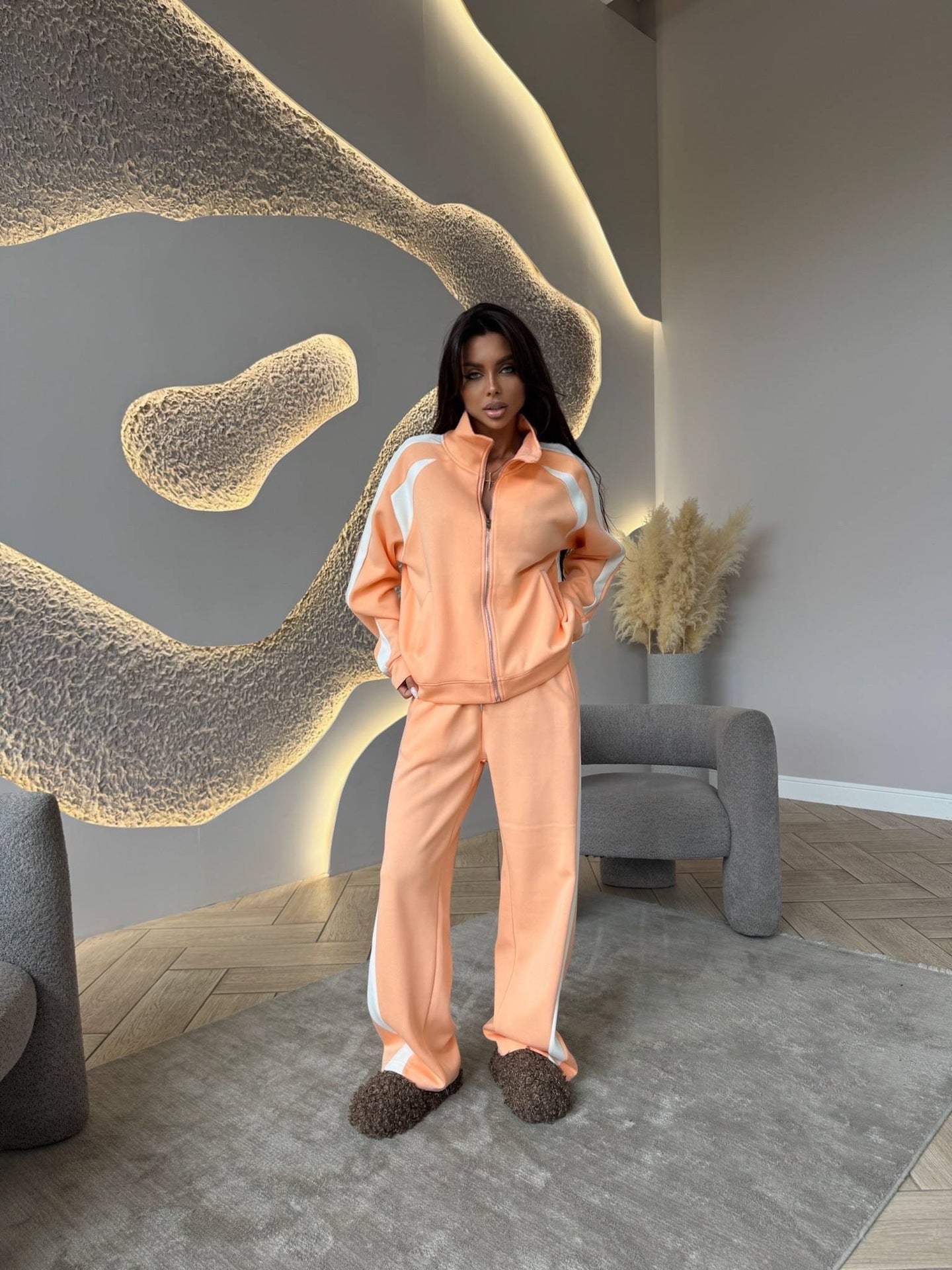 Women’s long-sleeve zip-up jacket and sweatpants two-piece set by FitiqueFit, featuring casual comfortable loungewear style.