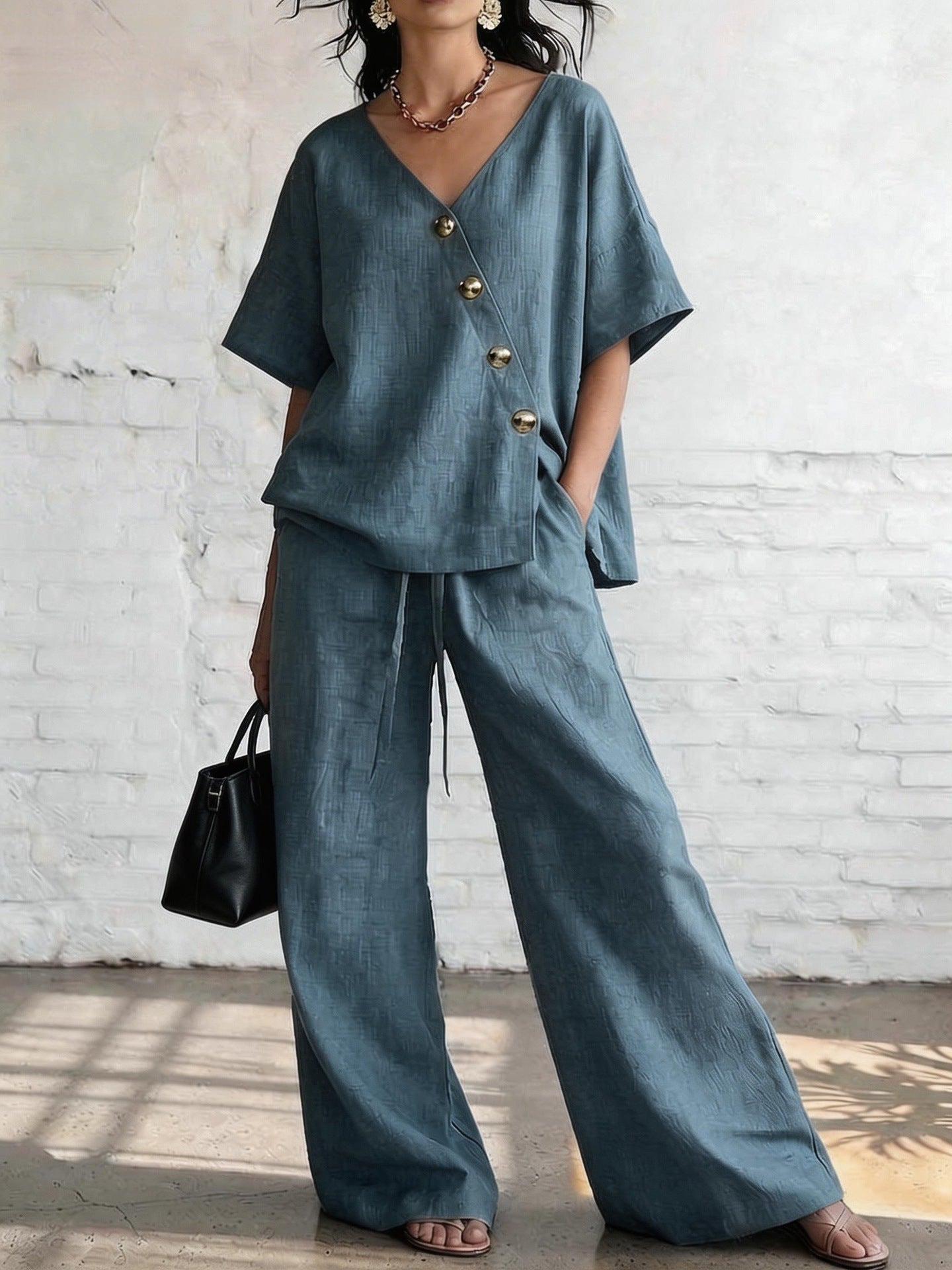 Women's loose cotton-linen V-neck top and wide-leg pants set by FitiqueFit, casualwear with relaxed fit and breathable fabric.