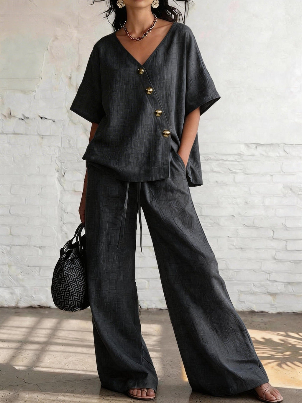 Women's loose cotton-linen V-neck top and wide-leg pants set by FitiqueFit, casualwear with relaxed fit and breathable fabric.