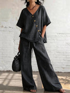 Women's loose cotton-linen V-neck top and wide-leg pants set by FitiqueFit, casualwear with relaxed fit and breathable fabric.