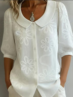 Women's loose-fit retro floral embroidered casual shirt by FitiqueFit with 3D embroidery and button details.