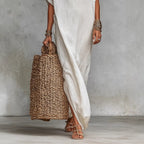 Women’s loose long batwing sleeve dress by FitiqueFit, casualwear with flowing fabric and relaxed fit, shown on a model.