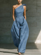 Women’s loose sleeveless off-shoulder jumpsuit with belt and wide-leg design, casualwear by FitiqueFit, shown on a model.
