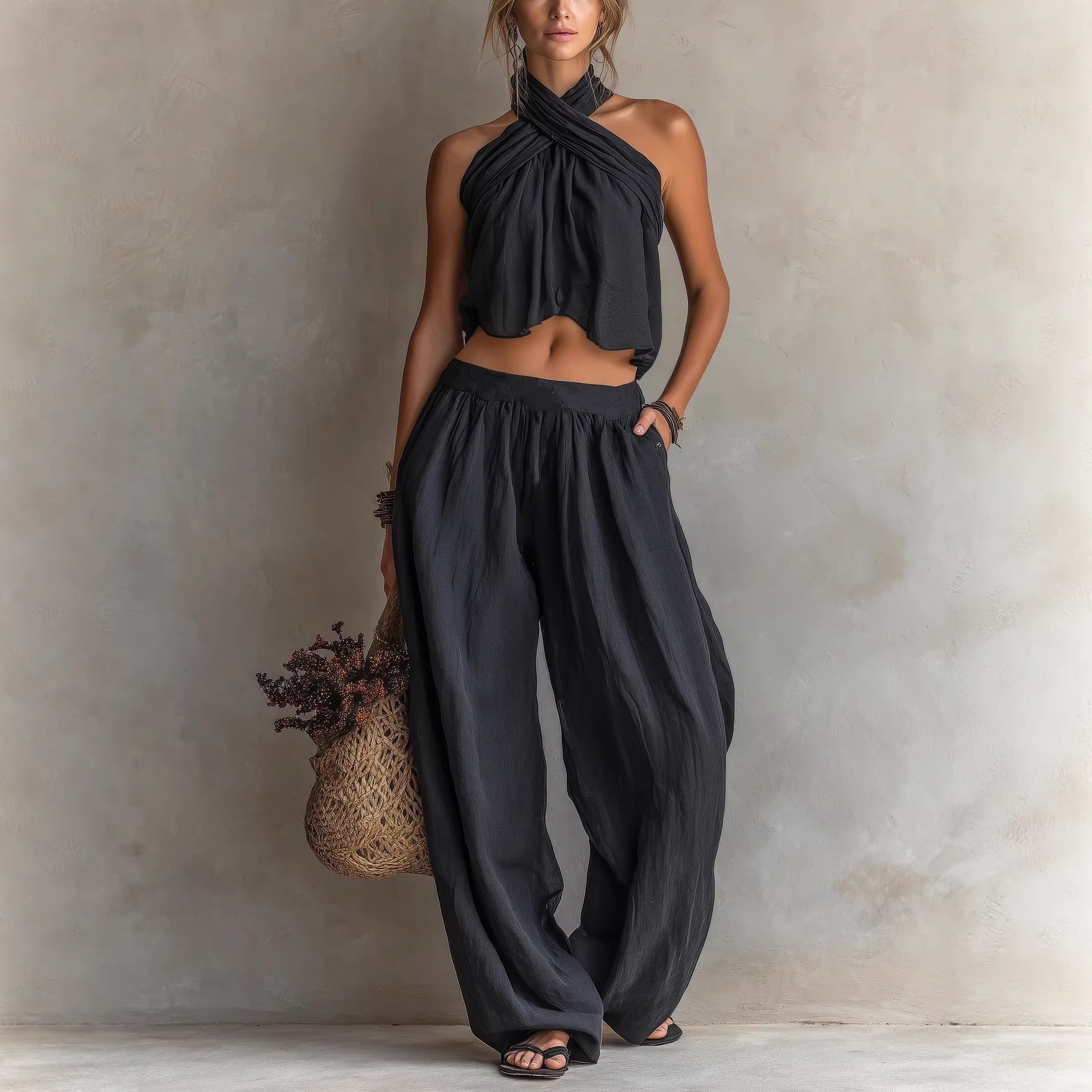 Women's loose sleeveless linen blend top and wide-leg pants set, casualwear by FitiqueFit, displayed on a model.