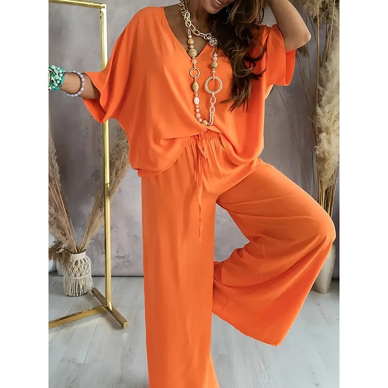 Women’s lounge set by FitiqueFit featuring a casualwide-leg pant and matching top, perfect for comfortable home wear.