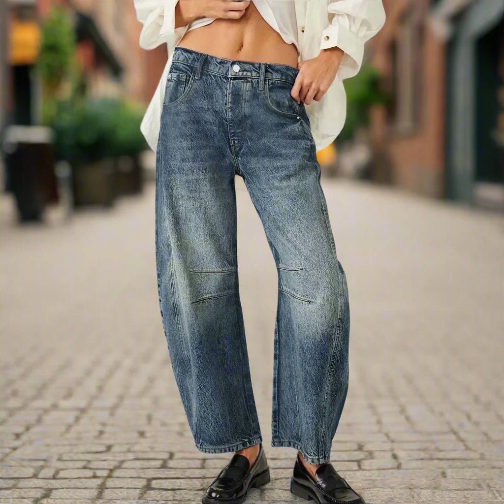 Women’s mid-rise wide-leg jeans by FitiqueFit, casualwear with a relaxed fit and classic denim style, shown on a model.