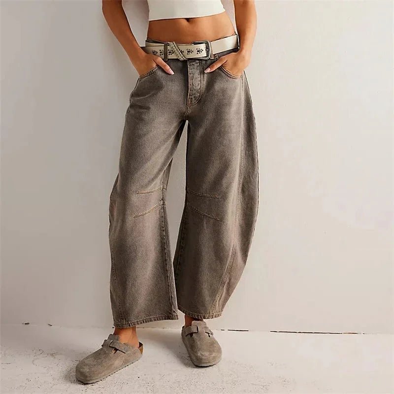 Women’s mid-rise wide-leg jeans by FitiqueFit, casualwear style, shown on a model with a relaxed fit and classic denim wash.