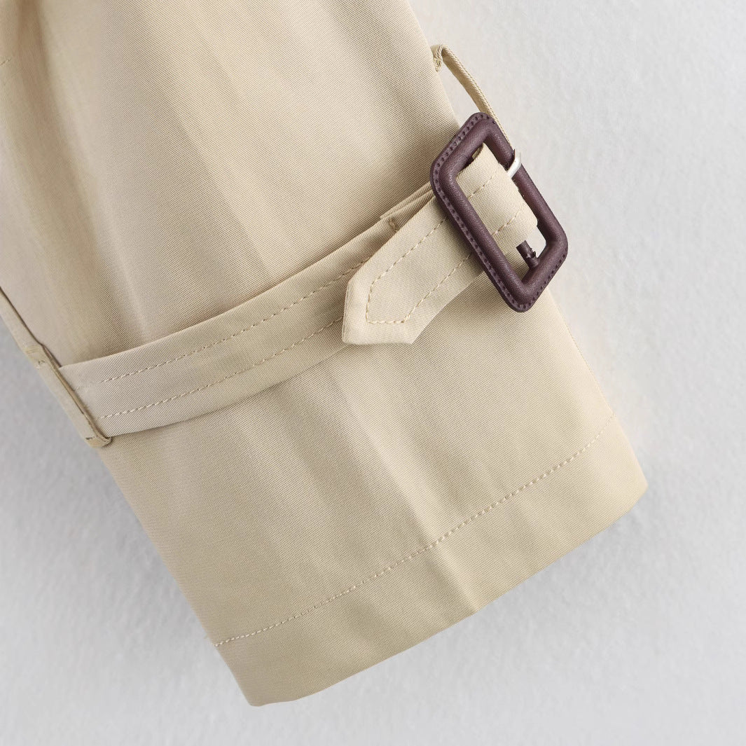 Women's short trench coat with notch collar and belt buckle detail, stylish FitiqueFit jacket for a chic, polished look.