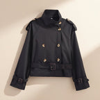 Women's short trench coat with notch collar and belt buckle detail, stylish FitiqueFit jacket for a chic, modern look.