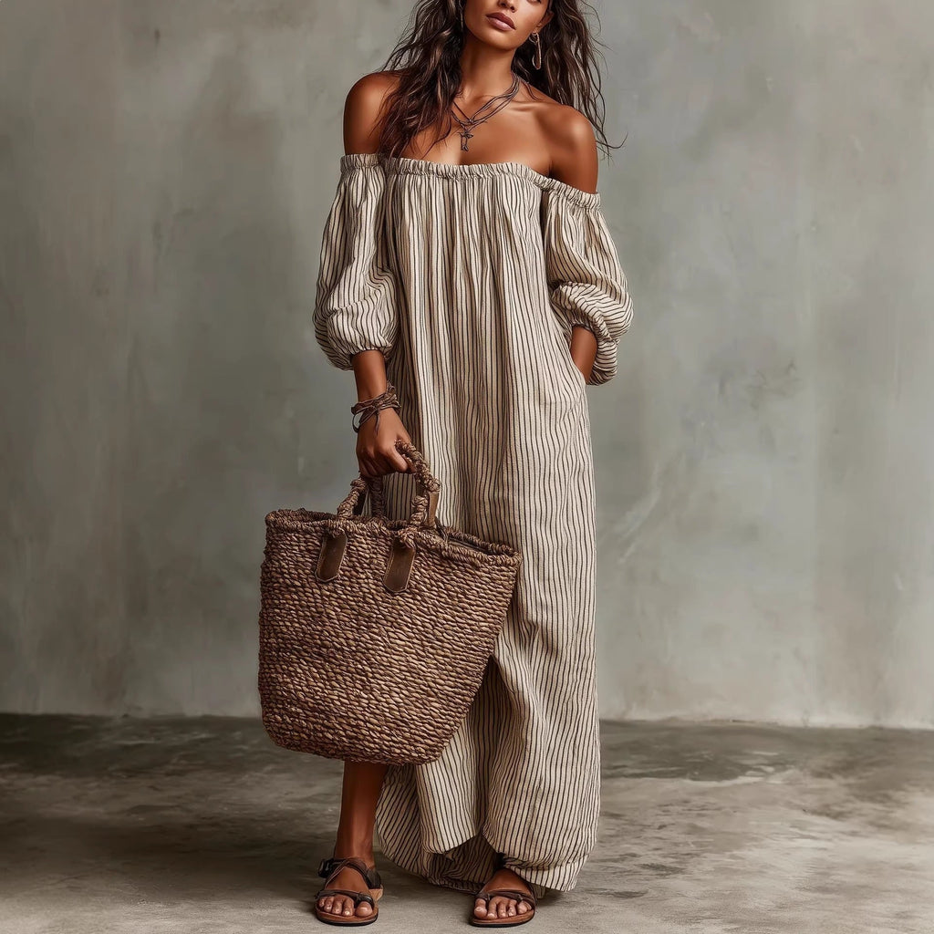 Women's off-shoulder long-sleeve maxi dress by FitiqueFit, casualwear style with flowing fabric and elegant neckline.