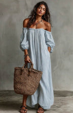 Women's off-shoulder long-sleeve maxi dress by FitiqueFit, casualwear with flowing fabric and elegant neckline.