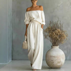 Women's off-shoulder long-sleeve top and wide-leg pants two-piece casualwear set by Plush Fashion Hub, styled for a relaxed look.