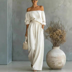 Women's off-shoulder long-sleeve top and wide-leg pants two-piece set by Plush Fashion Hub, casualwear outfit on a model.