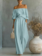 Women’s off-shoulder long-sleeve top and wide-leg pants two-piece casualwear set by Plush Fashion Hub, shown on a model.