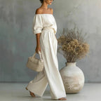 Women's off-shoulder long-sleeve top and wide-leg pants two-piece casualwear set by Plush Fashion Hub, styled on a model.
