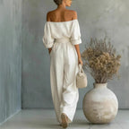 Women’s off-shoulder long-sleeve top and wide-leg pants two-piece casualwear set by Plush Fashion Hub, styled on a model.