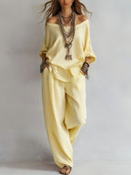 Women's off-shoulder top and wide-leg pants casualwear set by FitiqueFit, featuring a stylish, relaxed fit in soft fabric.