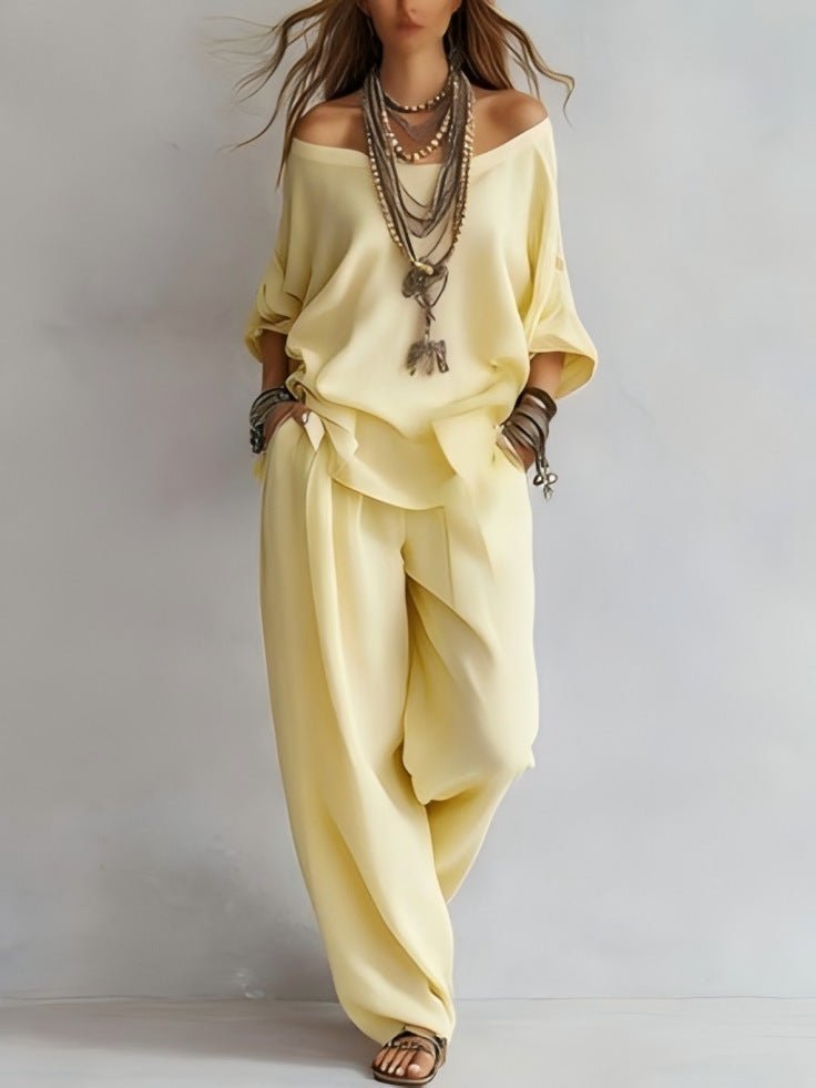 Women's off-shoulder top and wide-leg pants casualwear set by FitiqueFit, featuring a stylish, relaxed fit in soft fabric.