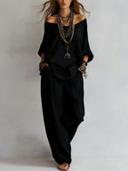 Women's off-shoulder top and wide-leg pants casualwear set by FitiqueFit, featuring a stylish, relaxed fit and comfortable fabric.