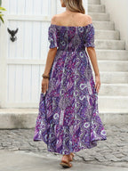 Women’s paisley one-shoulder maxi dress by FitiqueFit, casualwear style, featuring flowing fabric and elegant design.
