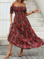 Women’s paisley one-shoulder maxi dress by FitiqueFit, showcasing flowing fabric and stylish casualwear design.