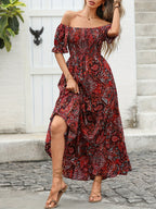 Women’s paisley one-shoulder maxi dress by FitiqueFit featuring flowing casualwear style and vibrant pattern.