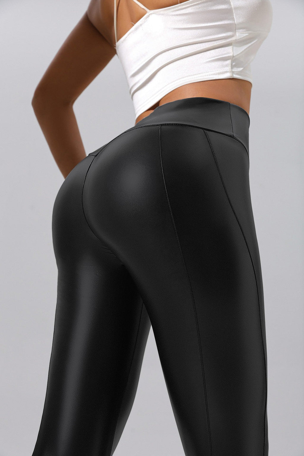 Women’s patchwork leather pants by FitiqueFit, casualwear for running, fitness, and yoga, featuring stylish leather patchwork design.