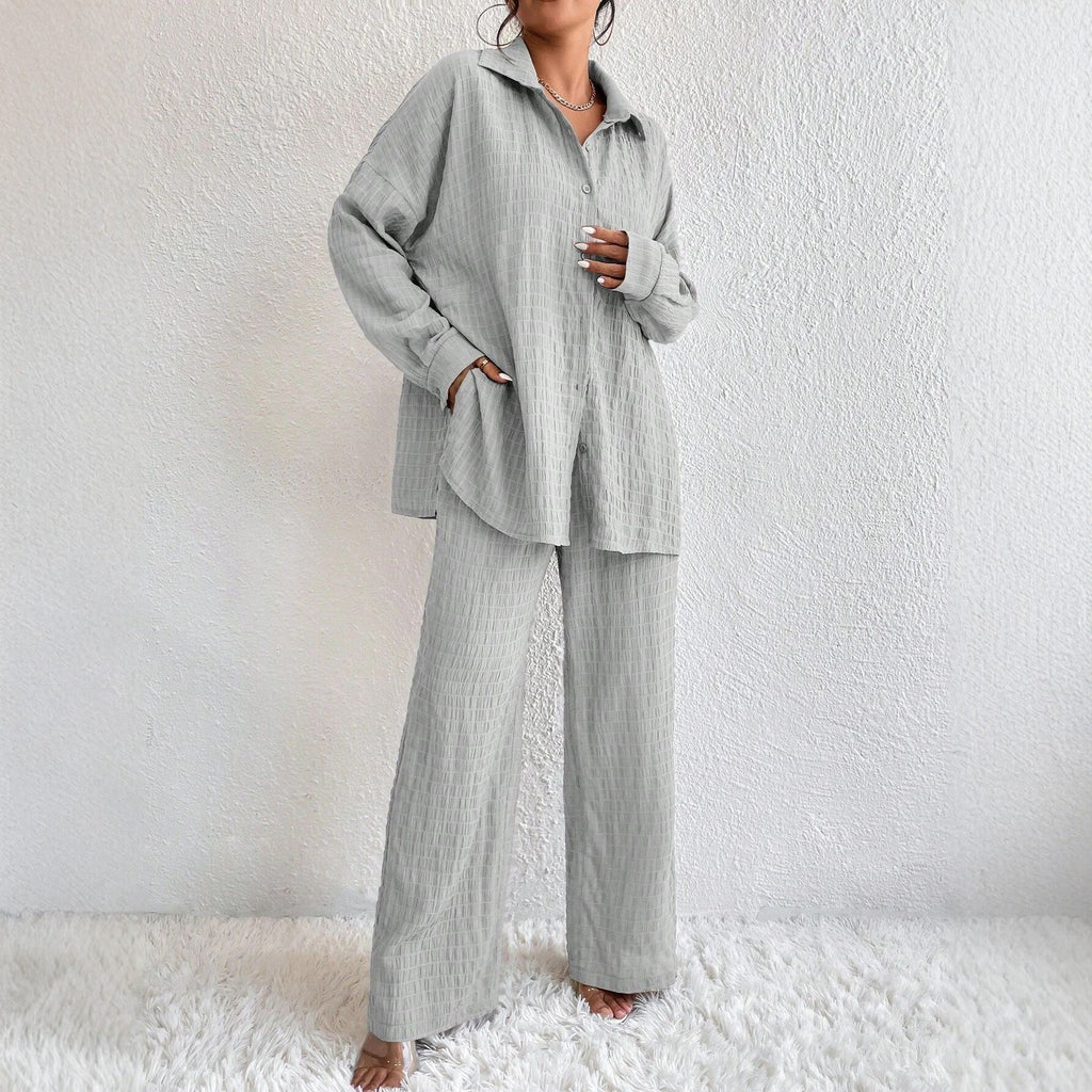 Women's pleated long sleeve lapel two-piece set by FitiqueFit with loose top and matching pants, casualwear ensemble.