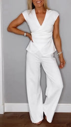 Women's pleated vest and pants set by FitiqueFit featuring metal buckle details, casualwear with a stylish, relaxed fit.
